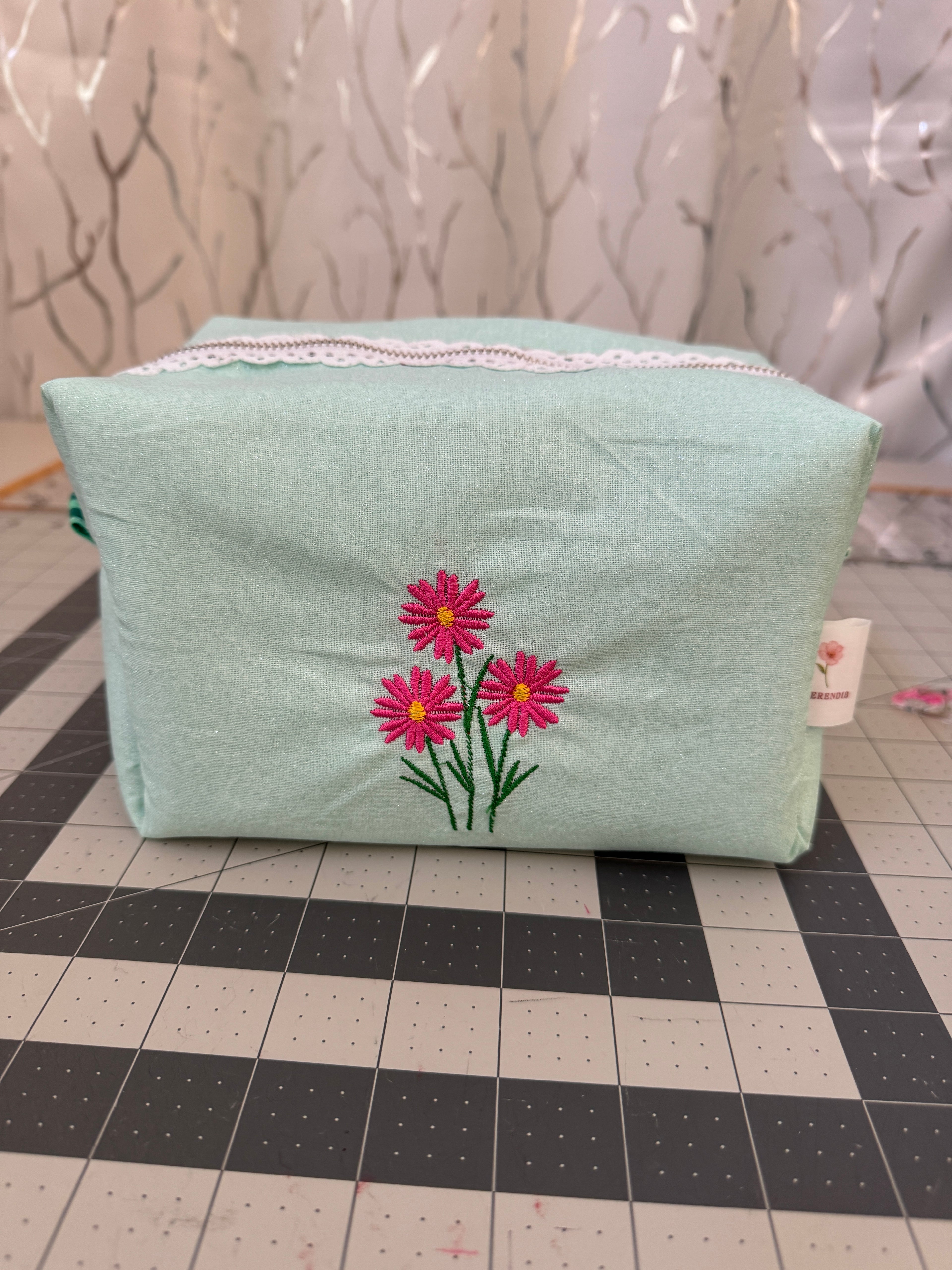 Embroidered bloom makeup bag